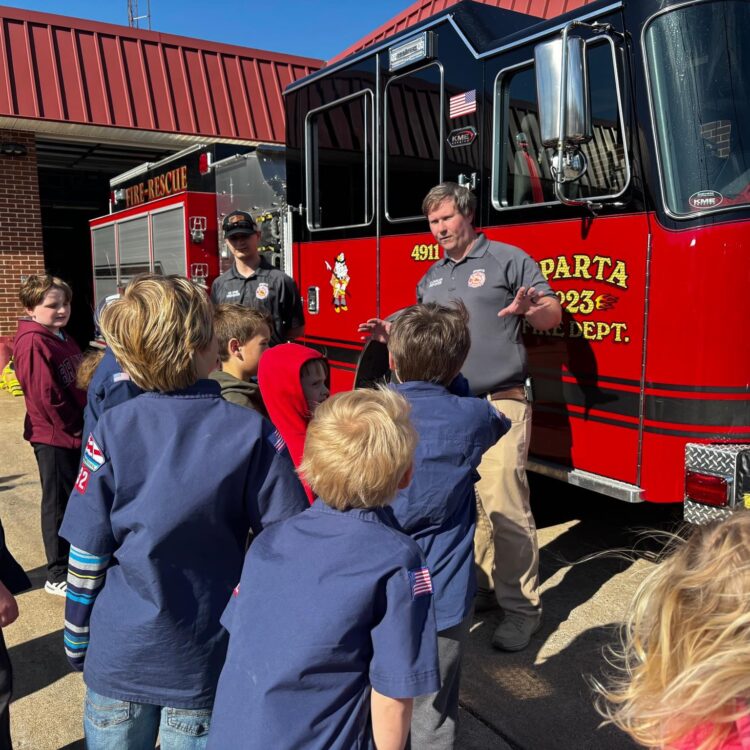 Firefighters instructing Cub Scouts